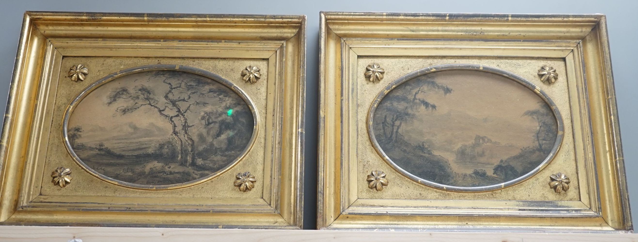 Reverend William Gilpin (1724-1804), pair of monochrome watercolours, River landscapes, Miles Wynne Cato labels verso, oval, 16 x 23cm, im matching period giltwood frames and another watercolour by Gilpin of a castle, 17